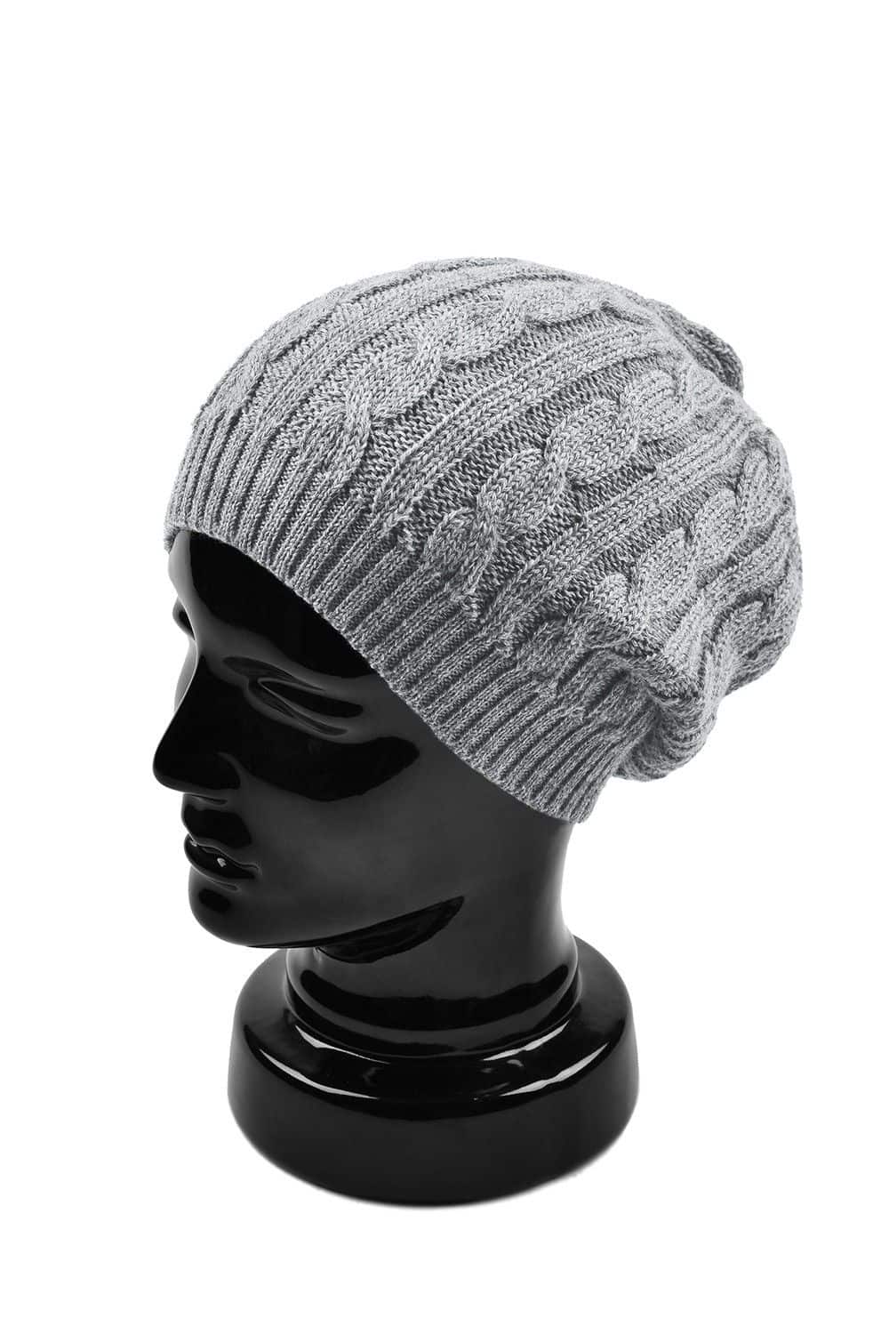 hellgraue Ballonmütze aus bio Merinowolle (kbT) vom Finkhof auf einem Puppenkopf