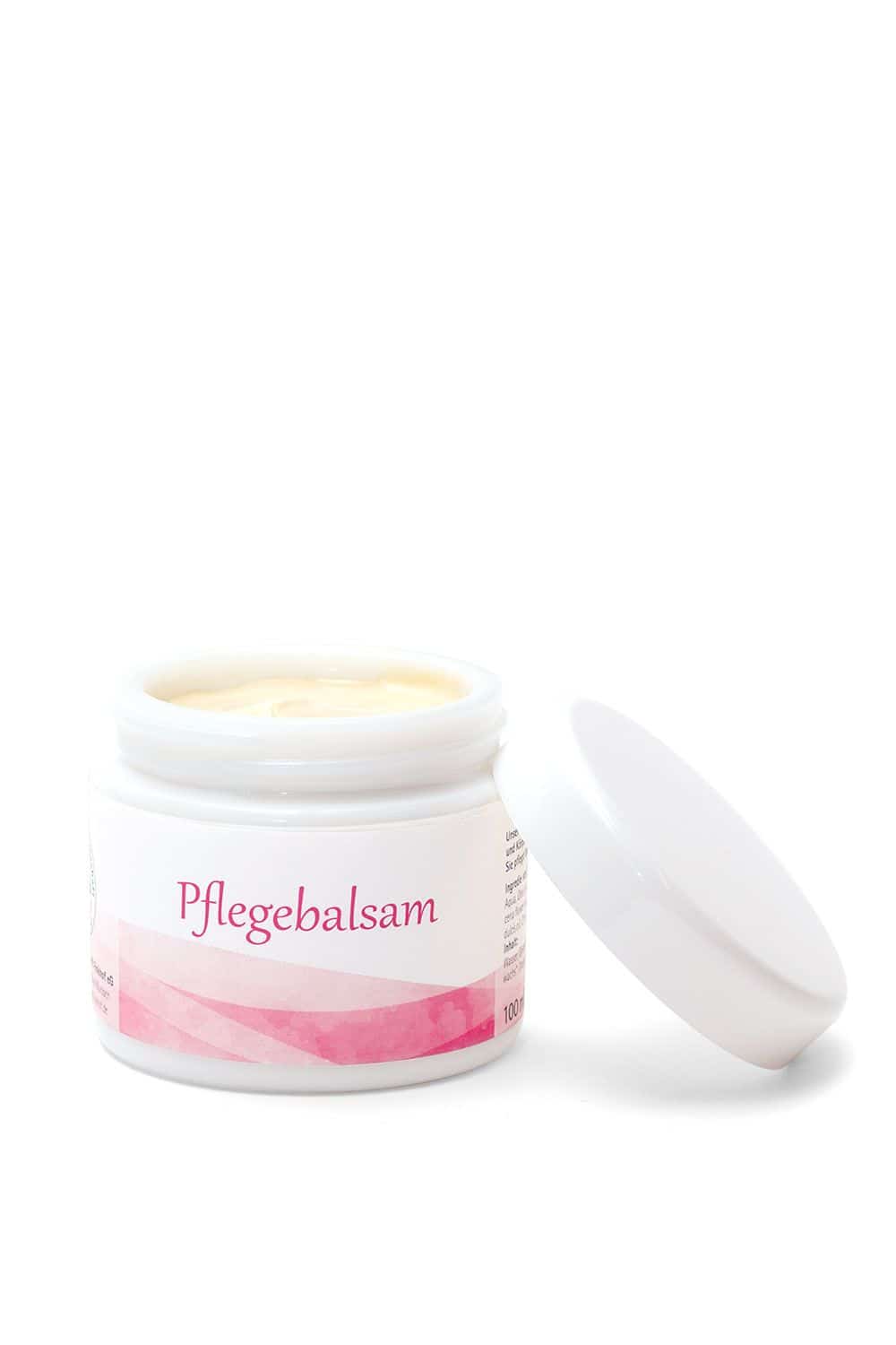 Finkhof Pflegebalsam im offenen Glastiegel – Naturkosmetik mit Wollwachs und Olivenöl, dekoriert mit Orange und grünen Blättern