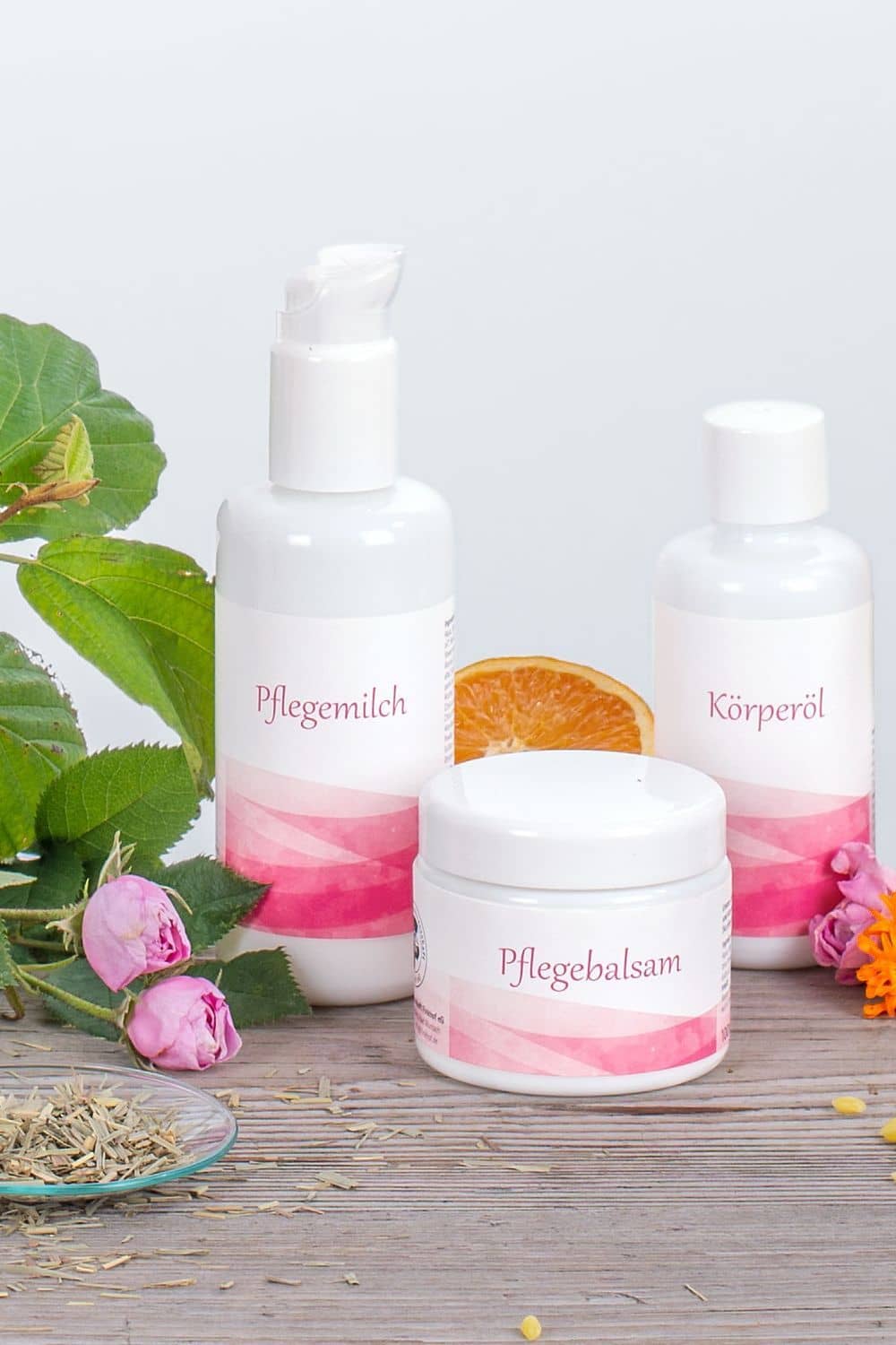 Finkhof Zitrus Pflegeset auf Stimmungsbild mit Orangen und Blüten