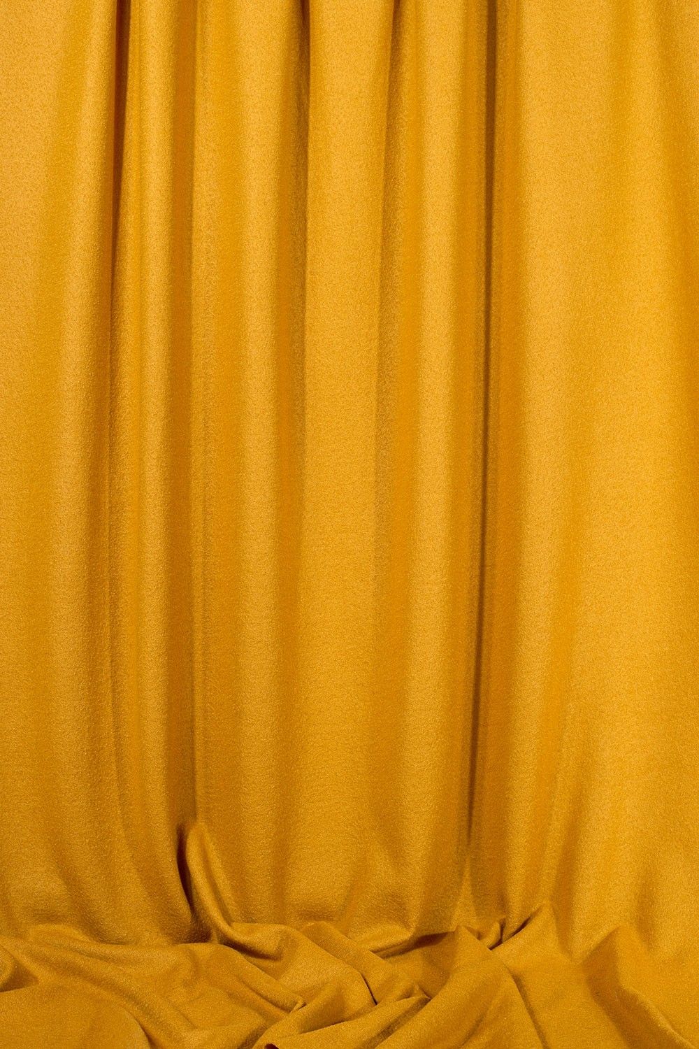 hängende Stoffbahn von gelbem Feinstrick aus bio Wolle (kbT)