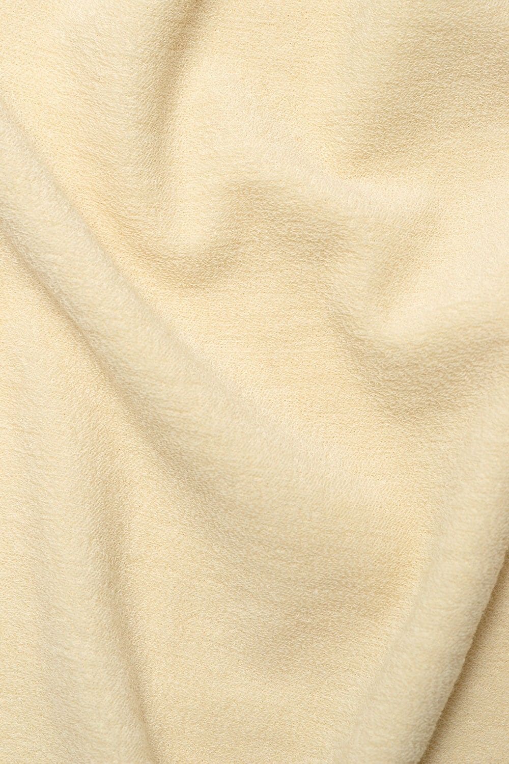 Nahaufnahme des naturweißen Wollfrotte-Schlafanzüge aus bio Wolle (kbT)