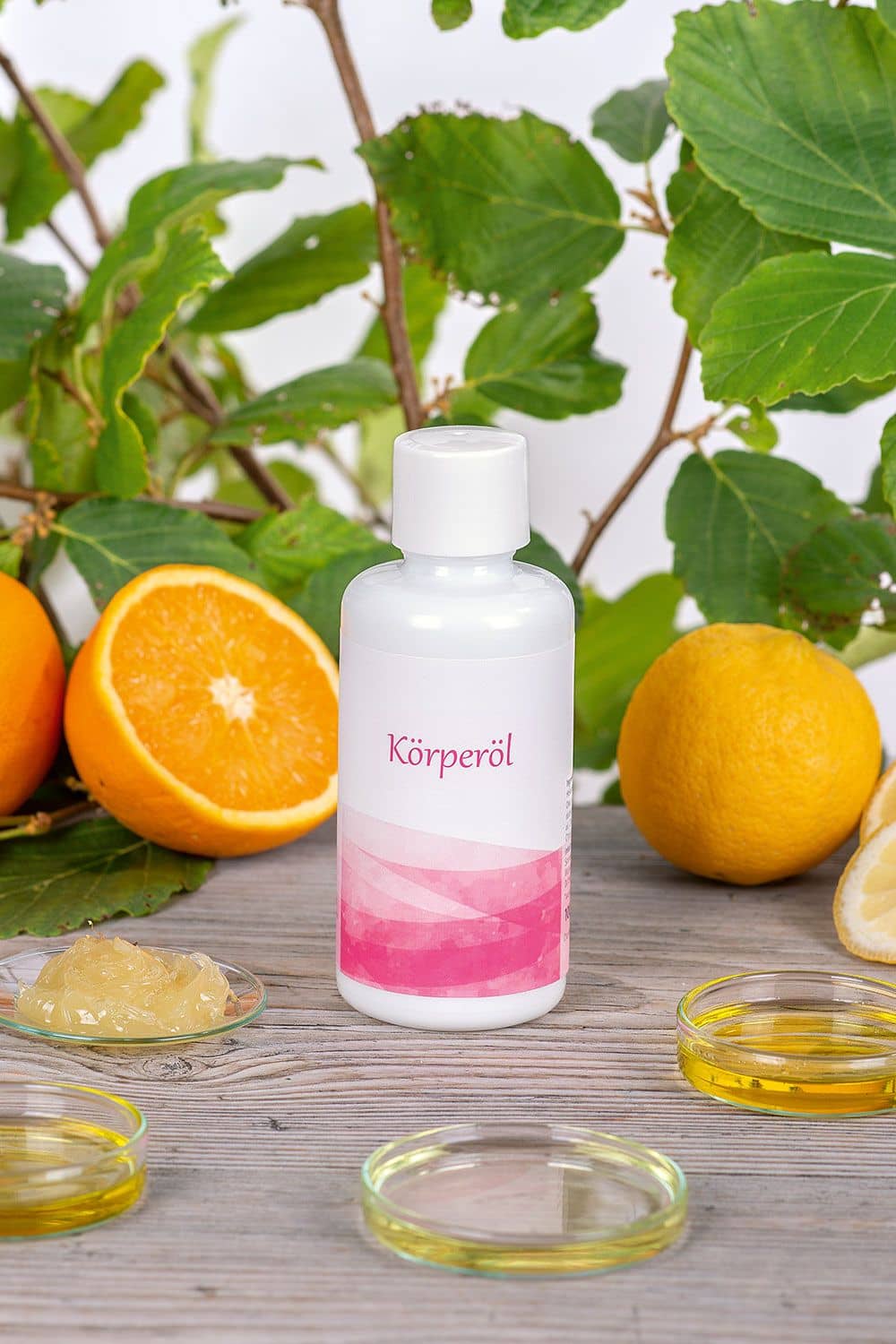 Körperöl 100 ml Finkhof Körperöl 100 ml im Glas-Pumpspender – mit Olivenöl, Mandelöl, Wollwachs & Zitrusduft, dekoriert mit Orange