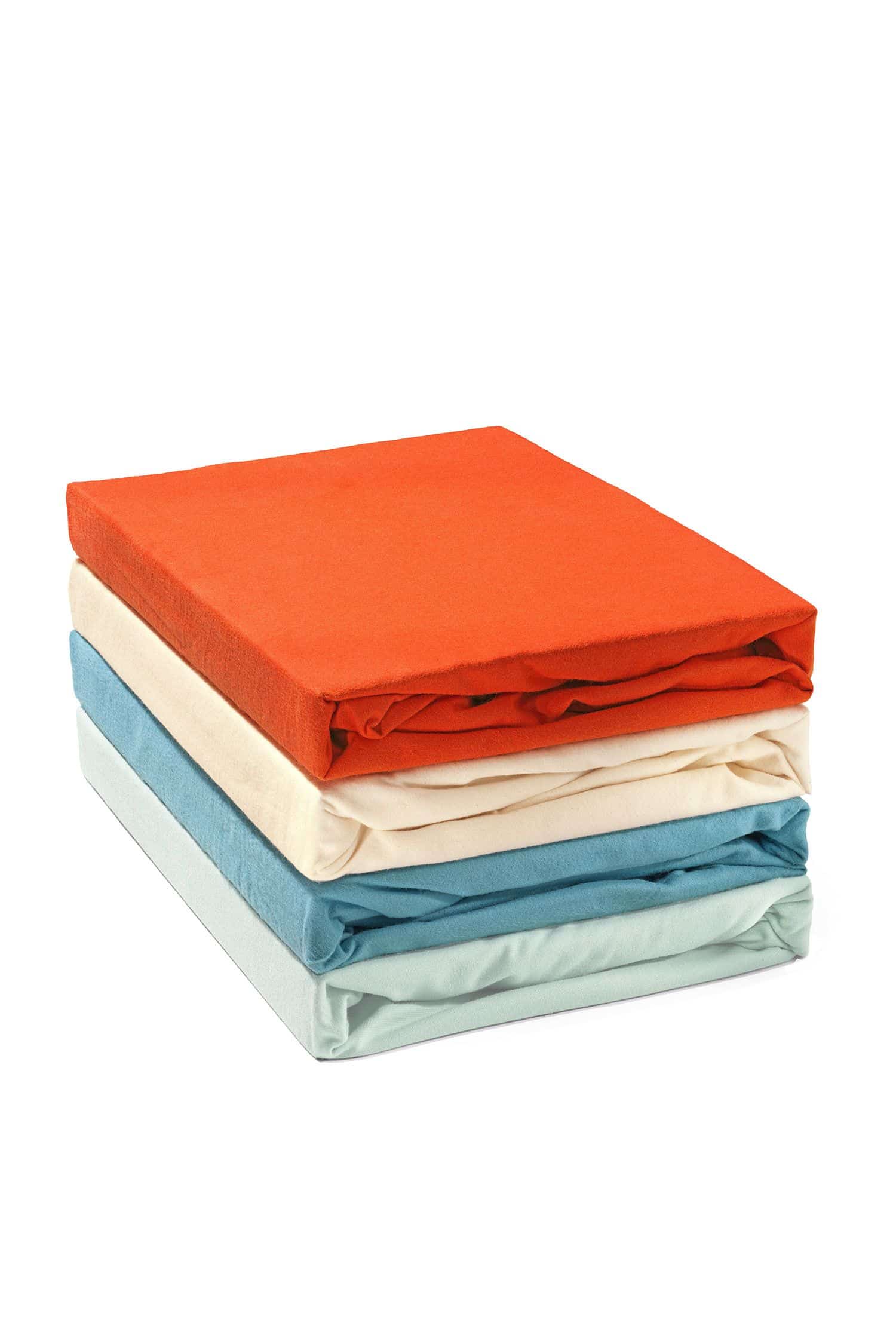 Biberspannlaken Gefaltete Biberspannbettlaken aus bio Baumwolle (kbA) in verschiedenen Farben gestapelt